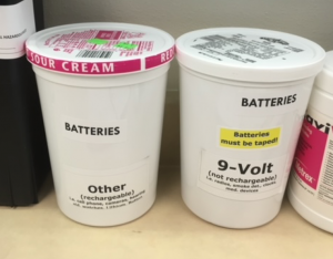 Batteries stored in plastic containers