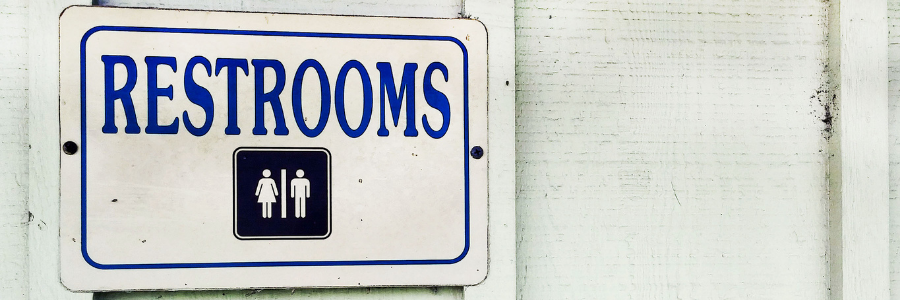 Sign for public restrooms on outside of building